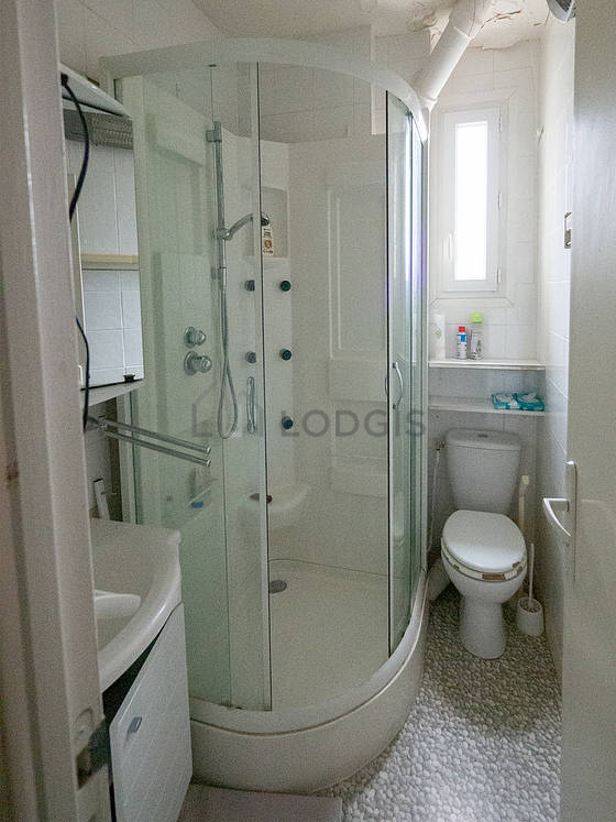 Pleasant and very bright bathroom with wooden floor