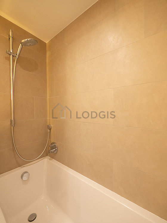 Bathroom equipped with washing machine, bath towels