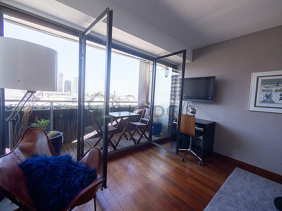 Living room with windows and balcony