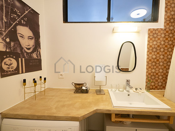 Bathroom equipped with washing machine, bath towels