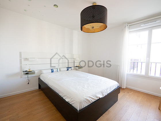 Bedroom with wooden floor