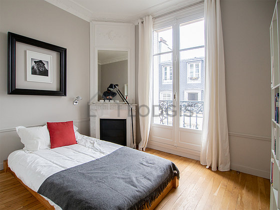 Bedroom with wooden floor