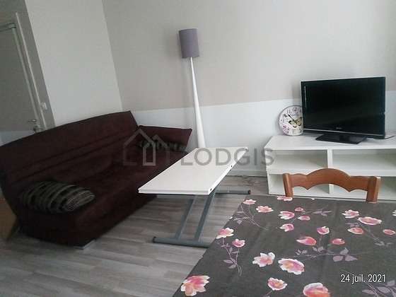 Very quiet living room furnished with tv, 1 chair(s)
