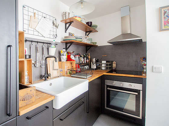 Very bright kitchen with double-glazed windows and balcony facing the courtyard