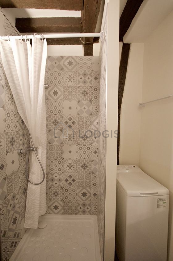 Bathroom equipped with washing machine, bath towels