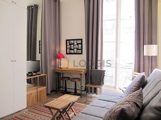 Quiet living room furnished with 1 sofabed(s) of 140cm, tv, wardrobe, cupboard