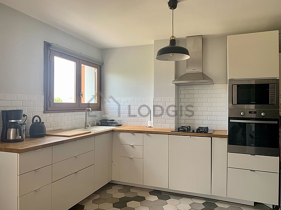 Kitchen equipped with coffee-maker