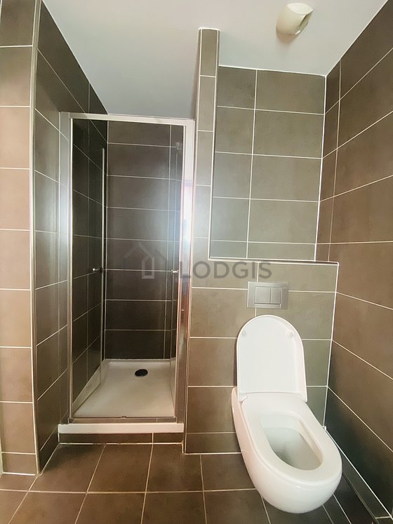 Kitchen equipped with hob, refrigerator, crockery