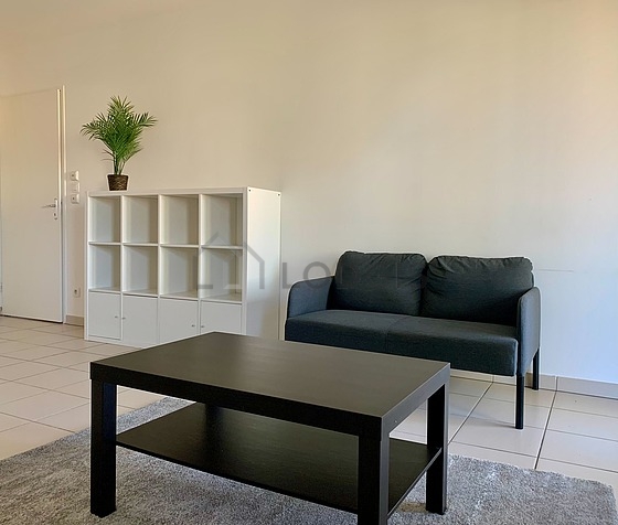 Living room furnished with sofa, coffee table, 1 chair(s)