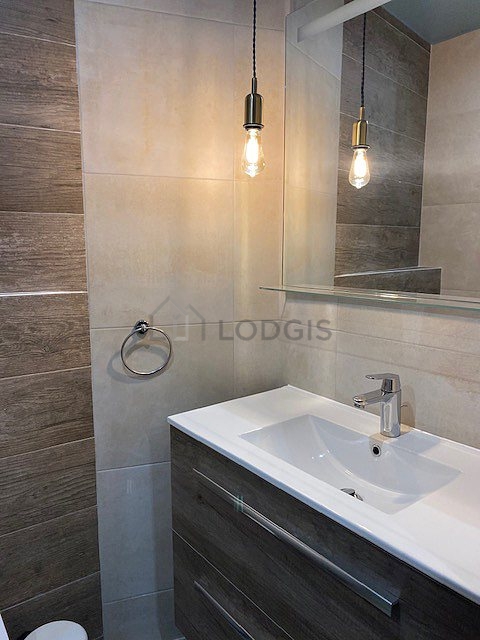 Pleasant and very bright bathroom with tile floor