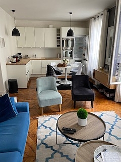 Living room furnished with tv, 1 armchair(s), 1 chair(s)