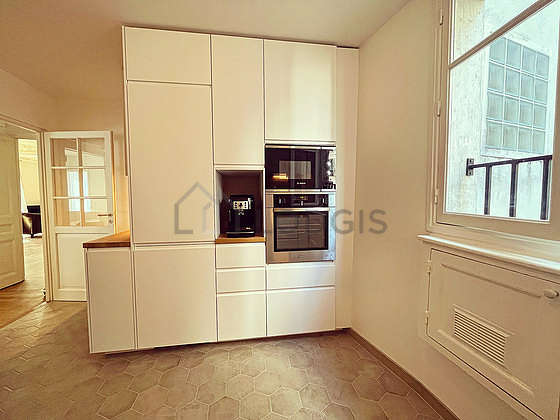 Kitchen equipped with refrigerator, freezer, crockery
