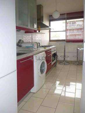 Kitchen equipped with washing machine, refrigerator, crockery
