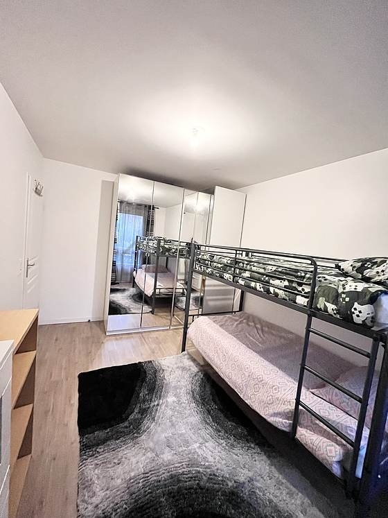 Bedroom with wooden floor