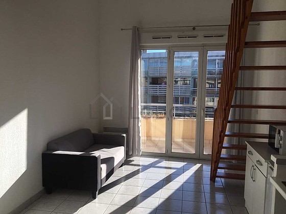 Living room with windows and balcony