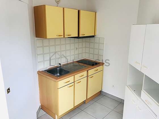 Kitchen equipped with hob, dining table