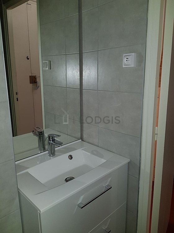 Bathroom equipped with washing machine, separate shower