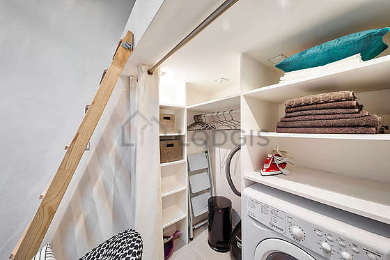 Bathroom equipped with washing machine, separate shower