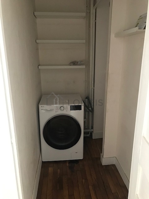 Bathroom equipped with washing machine, separate shower, towel drying radiator