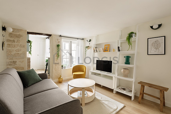 Living room furnished with 1 sofabed(s) of 140cm, tv, 1 armchair(s), 1 chair(s)