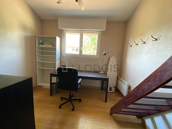 Office furnished with desk, closet