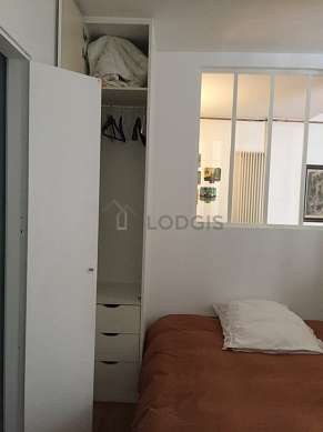 Very bright bedroom equipped with wardrobe, cupboard, bedside table