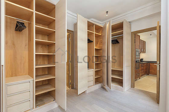 Very quiet and very bright walk-in closet with woodenfloor