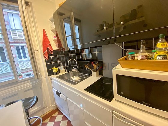Kitchen equipped with dishwasher, hob, refrigerator, freezer