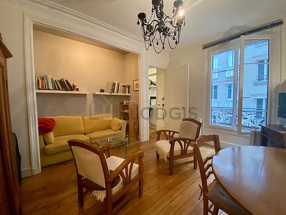 Very quiet living room furnished with tv, 1 armchair(s), 1 chair(s)