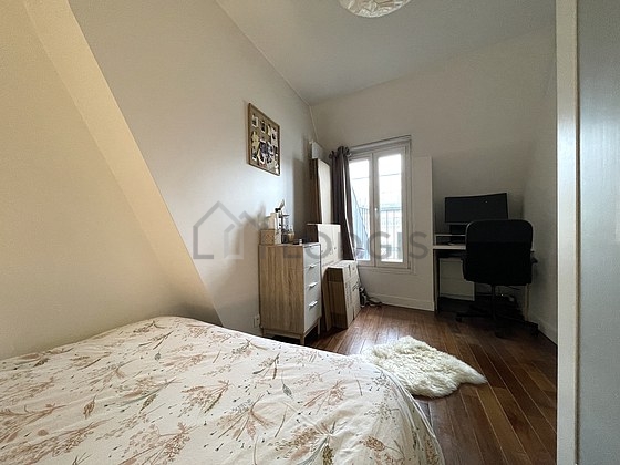 Bedroom with windows and balcony
