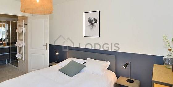 Bedroom equipped with storage space, bedside table