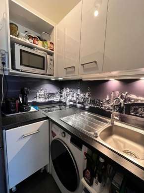 Kitchen equipped with washing machine, refrigerator, extractor hood