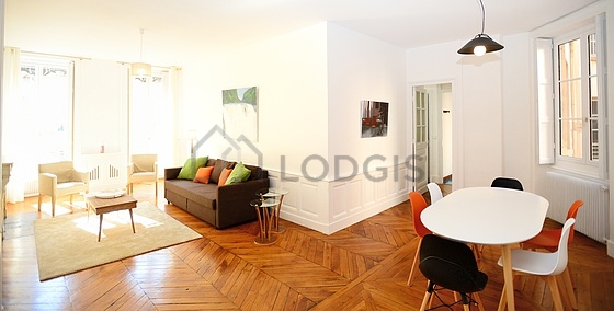 Living room furnished with tv, 1 armchair(s), 1 chair(s)