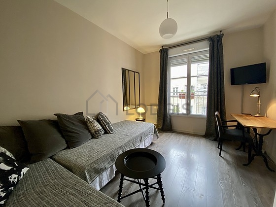 Very quiet living room furnished with 2 bed(s) of 80cm, tv, cupboard