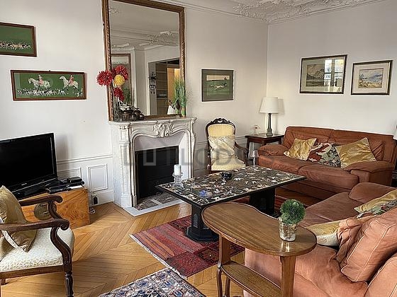 Living room furnished with tv, 2 armchair(s), 1 chair(s)