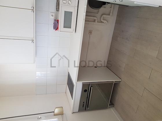 Kitchen equipped with hob, refrigerator
