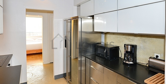 Kitchen equipped with dishwasher, refrigerator, extractor hood, crockery