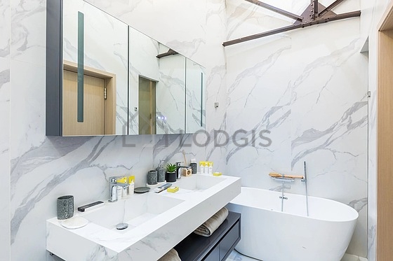 Pleasant and very bright bathroom with marble floor