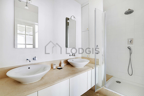 Bathroom equipped with washing machine, bath towels