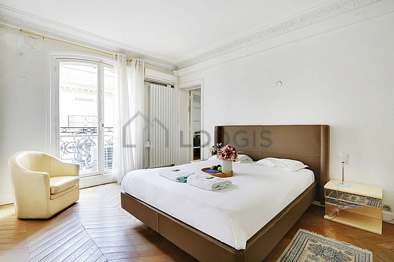 Bedroom with wooden floor