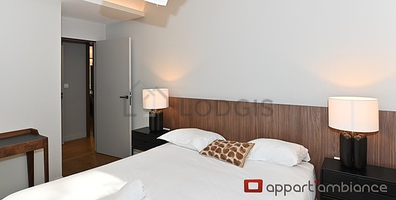 Bedroom equipped with 1 armchair(s), bedside table