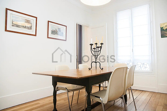 Dining room equipped with dining table, storage space