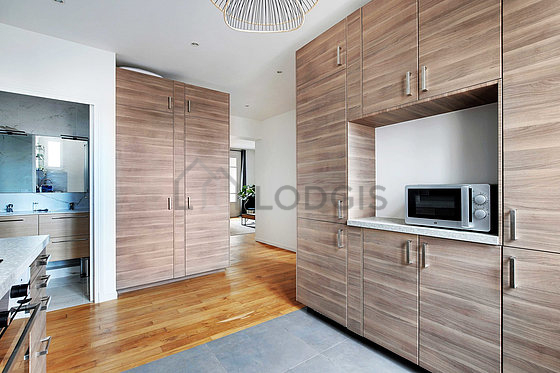Kitchen equipped with washing machine, refrigerator