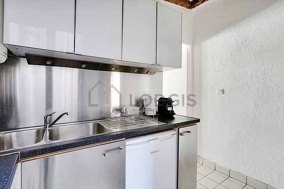 Kitchen equipped with washing machine, refrigerator