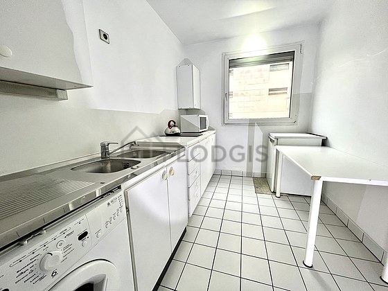Kitchen equipped with washing machine