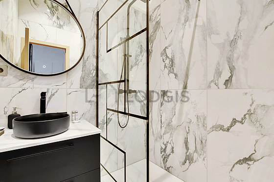 Pleasant and very bright bathroom with tile floor