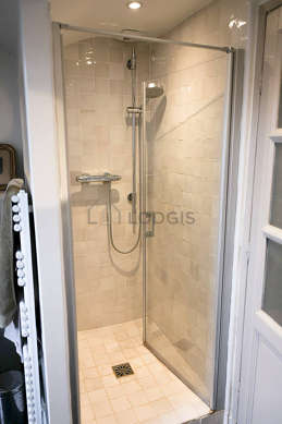 Bathroom equipped with washing machine, bath tub, separate shower