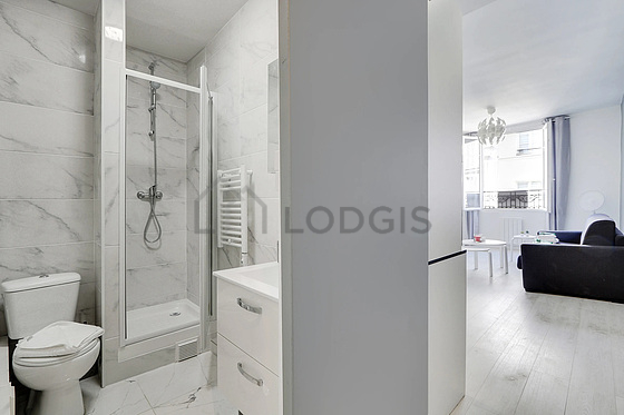 Bathroom equipped with separate shower, hair-dryer