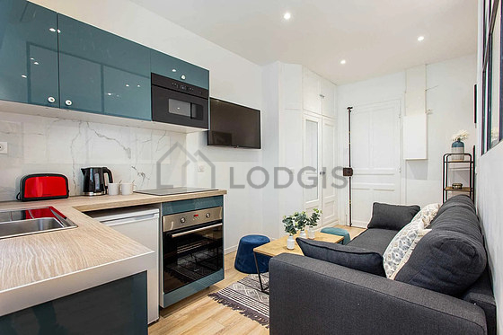 Kitchen equipped with hob, refrigerator