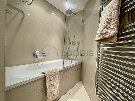 Pleasant and very bright bathroom with tile floor